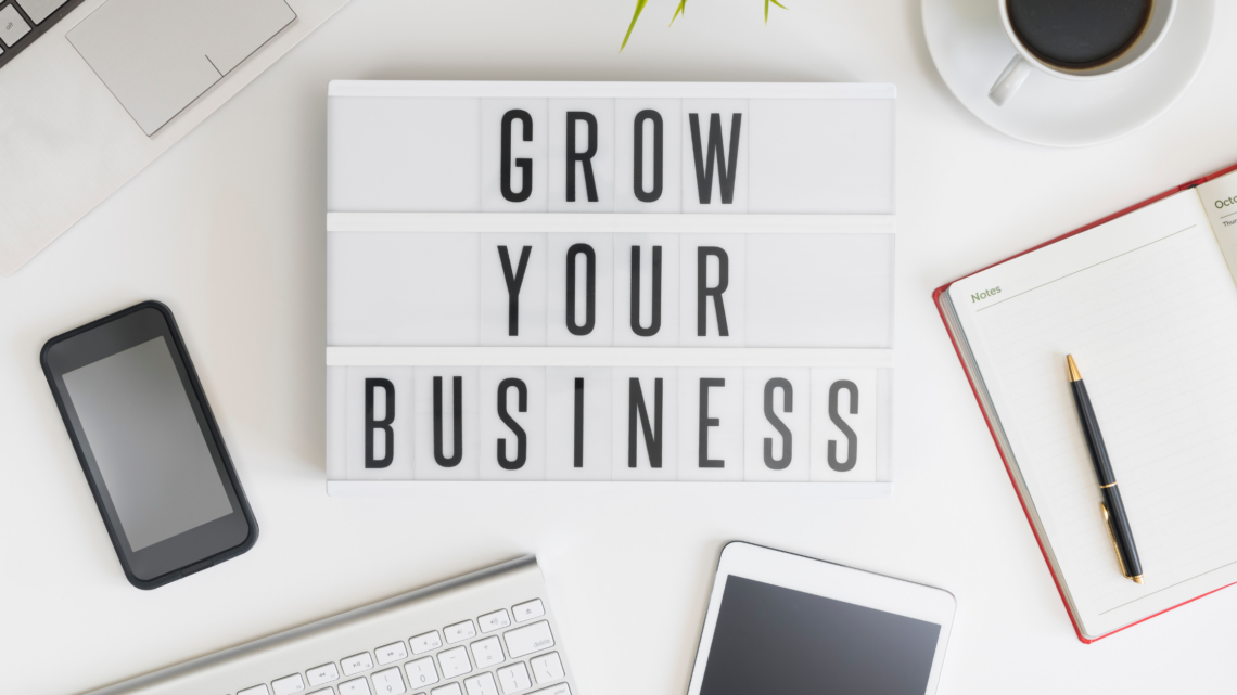 A plaque displaying the words "grow your business"