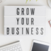 A plaque displaying the words "grow your business"